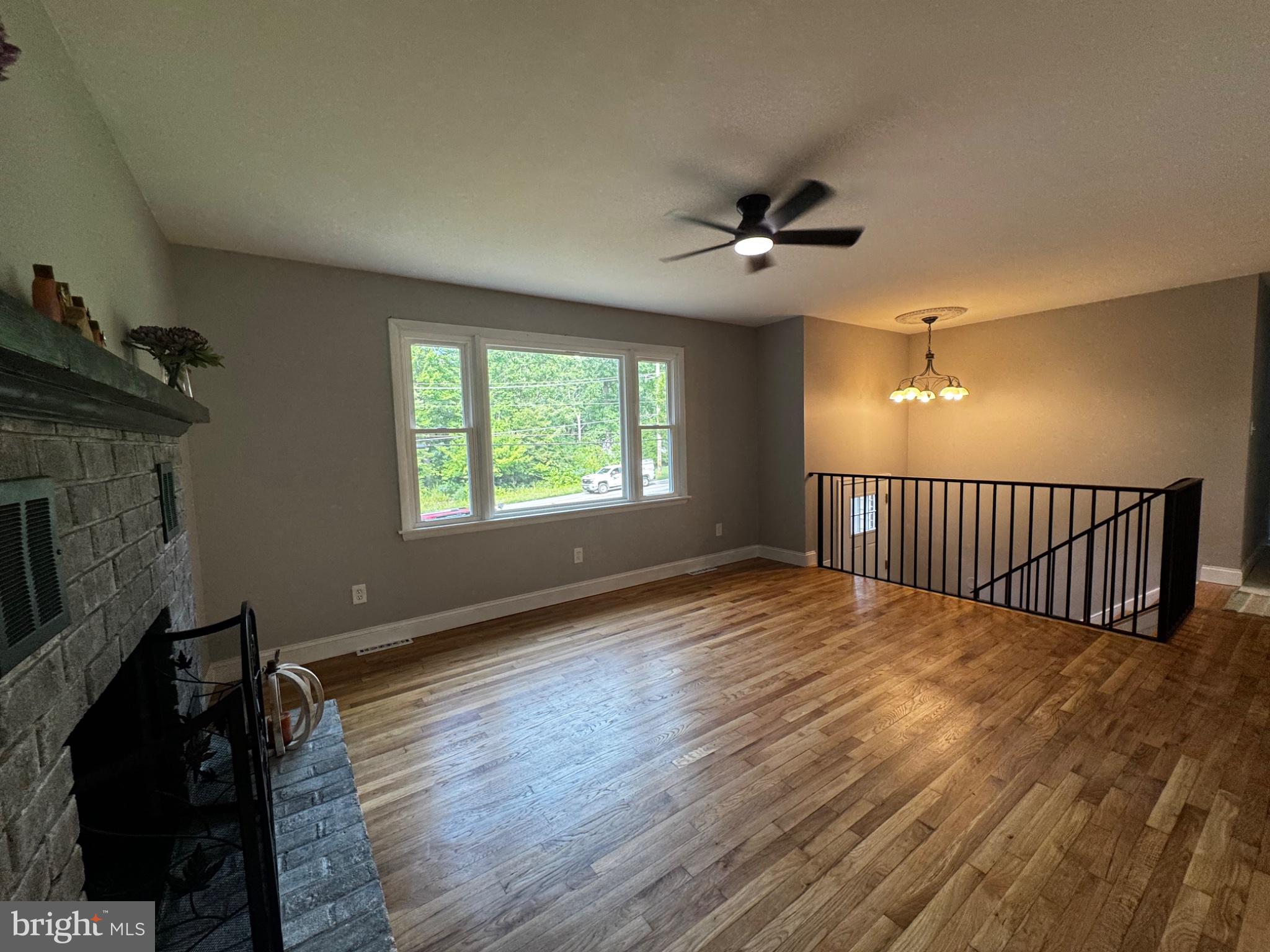 3719 Dublin Road Darlington, MD 21034 - Photo 11 of 28 Living room with brick fireplace