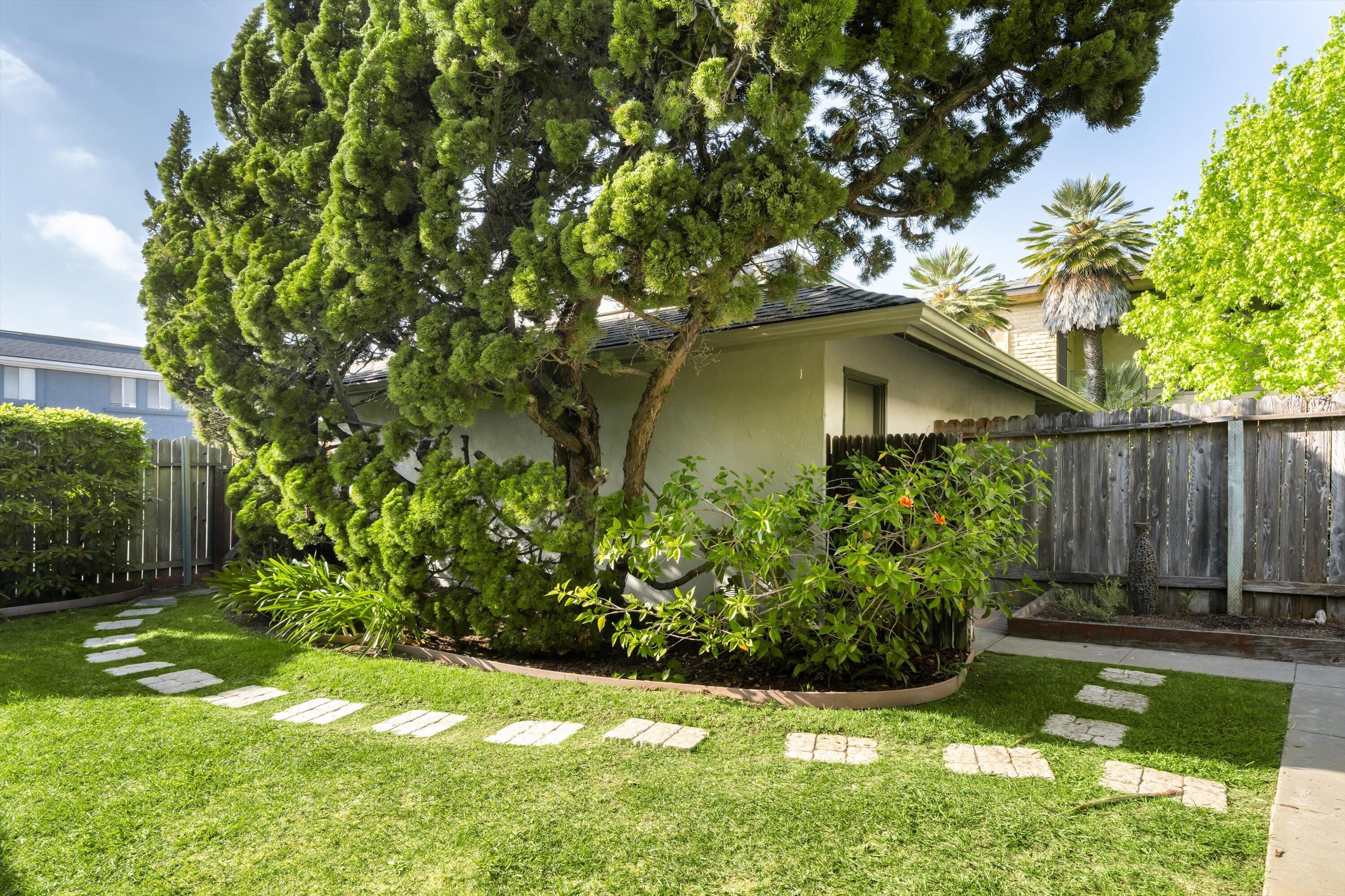 475 Linfield Place Goleta, CA 93117 - Photo 9 of 25 a view of a garden with a fountain