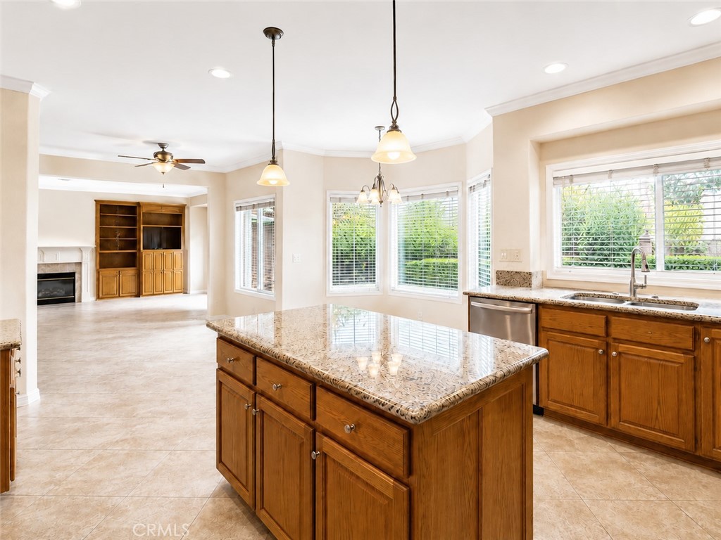 2811 North Roxbury Street Orange, CA 92867 - Photo 9 of 22 a kitchen with granite countertop a sink and center island