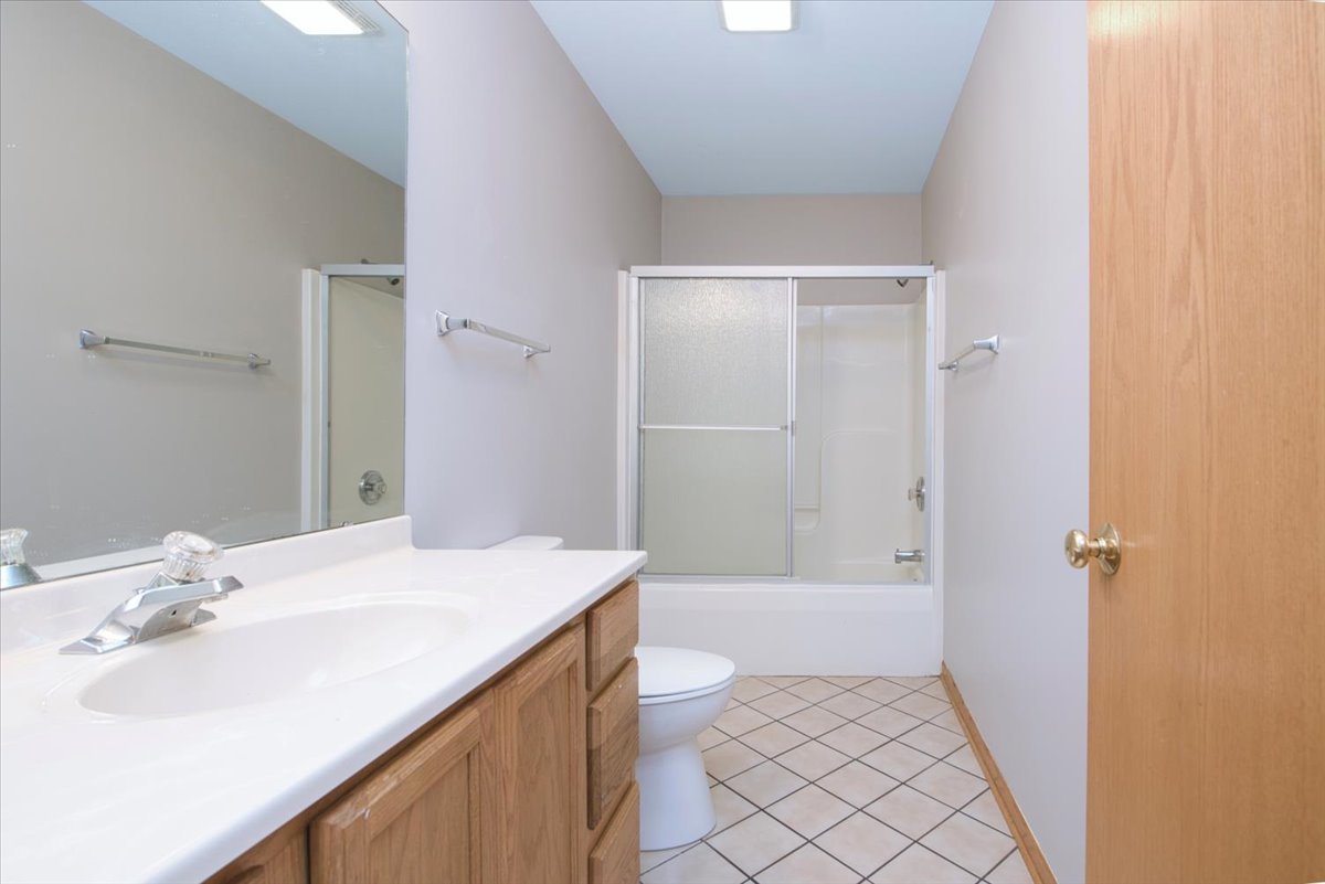 480 South Peace Road Sycamore, IL 60178 - Photo 11 of 22 a bathroom with a sink a toilet and shower