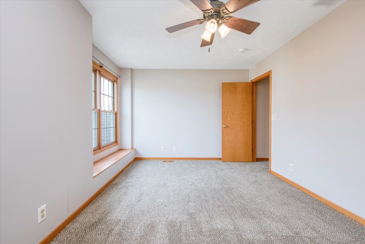 480 South Peace Road Sycamore, IL 60178 - Photo 13 of 22 an empty room with windows and fan