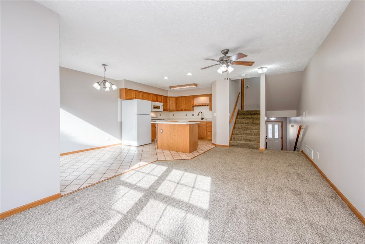 480 South Peace Road Sycamore, IL 60178 - Photo 6 of 22 an empty room with a windows and ceiling fan