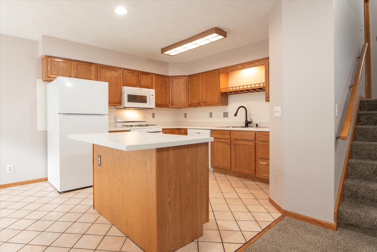 480 South Peace Road Sycamore, IL 60178 - Photo 9 of 22 a kitchen with stainless steel appliances a refrigerator sink and cabinets