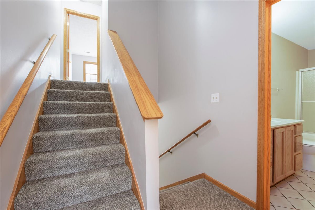 480 South Peace Road Sycamore, IL 60178 - Photo 10 of 22 a view of staircase with white walls and windows