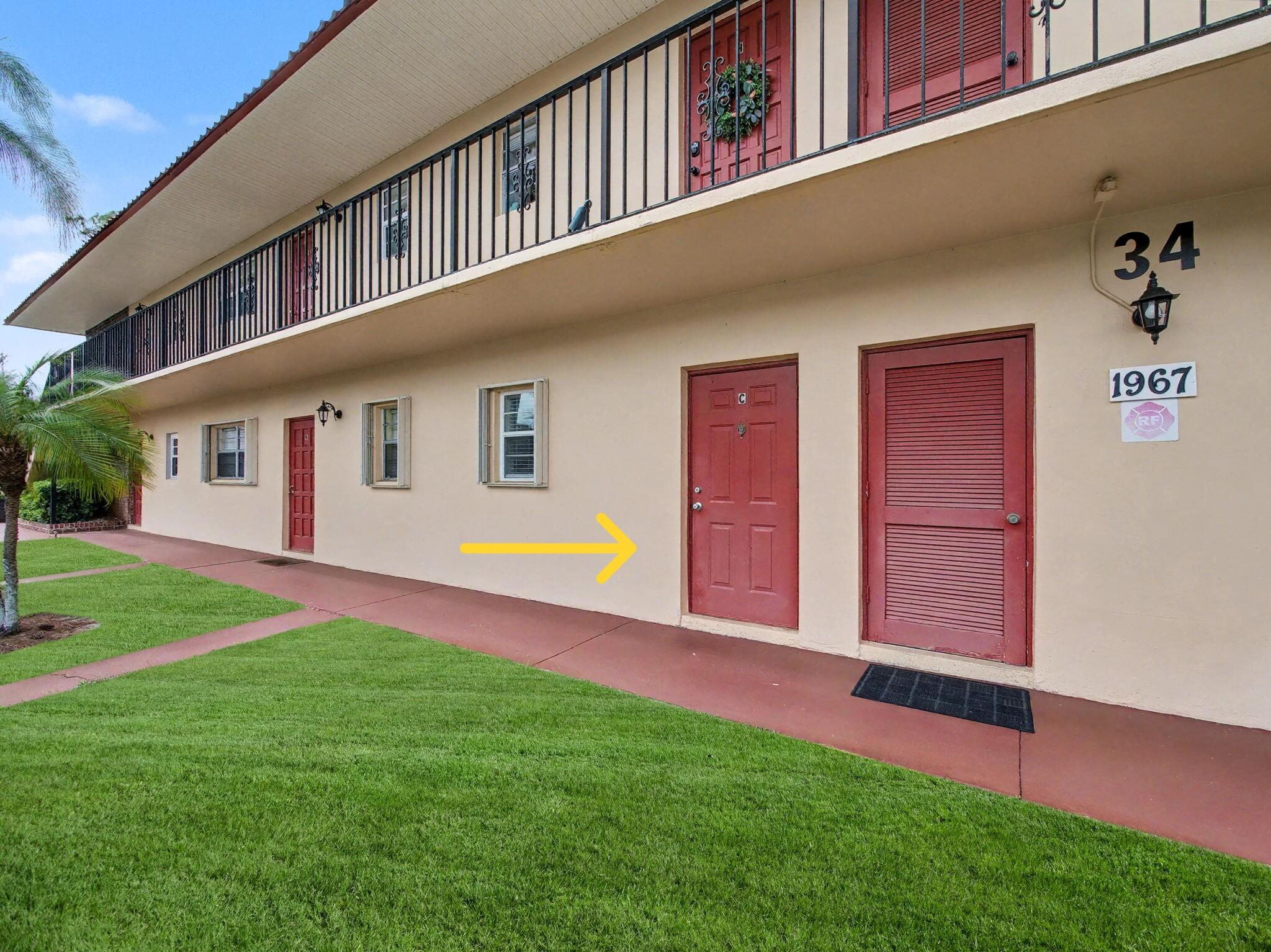 1967 Southwest Palm City Road, Unit 34C Stuart, FL 34994 - Photo 2 of 25 a view of an house with backyard and swimming pool