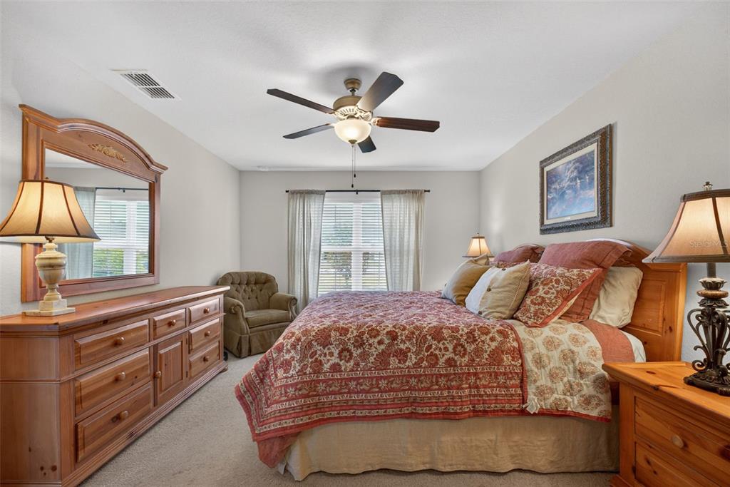 2429 Twin Lake View Road Winter Haven, FL 33881 - Photo 18 of 37 a bedroom with a bed and a window