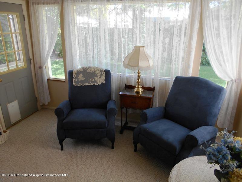 1321 East 8th Street Rifle, CO 81650 - Photo 11 of 15 a living room with furniture and a large window