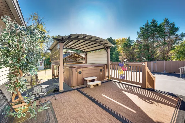a view of a house with pool and chairs