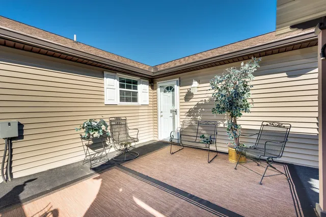 a view of a chairs and table in the patio
