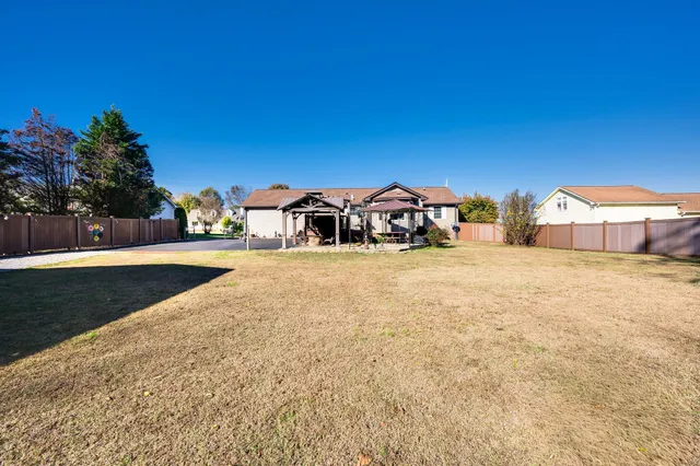 a view of a backyard of a house