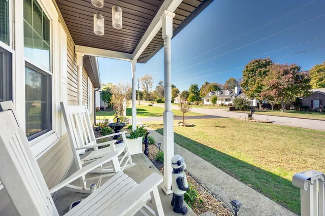 a view of a swimming pool with outdoor seating space