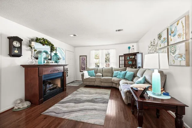 a living room with furniture and a fireplace
