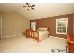 334 Wildbriar Road Fletcher, NC 28732 - Photo 11 of 20 a bedroom with a bed and window
