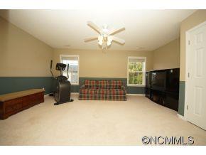 334 Wildbriar Road Fletcher, NC 28732 - Photo 13 of 20 a living room with a large bed and furniture