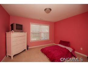334 Wildbriar Road Fletcher, NC 28732 - Photo 16 of 20 a bedroom with a bed and a dresser