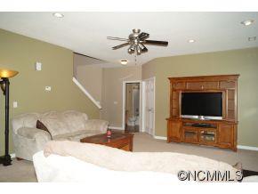334 Wildbriar Road Fletcher, NC 28732 - Photo 3 of 20 a living room with furniture and a flat screen tv