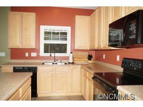 334 Wildbriar Road Fletcher, NC 28732 - Photo 5 of 20 a kitchen that has a sink and a stove in it