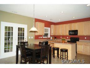 334 Wildbriar Road Fletcher, NC 28732 - Photo 6 of 20 a kitchen with a table and chairs