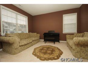 334 Wildbriar Road Fletcher, NC 28732 - Photo 9 of 20 a living room with a couch and a large window