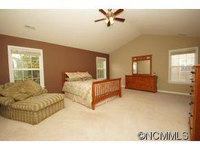 334 Wildbriar Road Fletcher, NC 28732 - Photo 10 of 20 a spacious bedroom with a bed and window