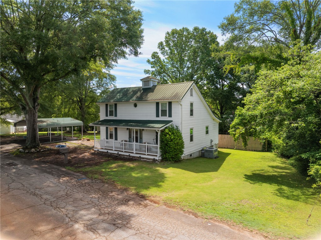 108 Tarrant Street Central, SC 29630 - Photo 4 of 42 A charming country residence with a wide front porch and a vast, verdant yard.