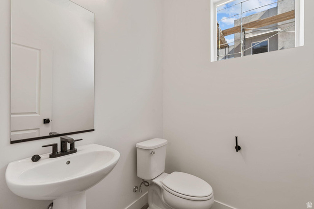 523 West Olive Lane St. George, UT 84790 - Photo 34 of 47 Half bathroom with toilet and baseboards