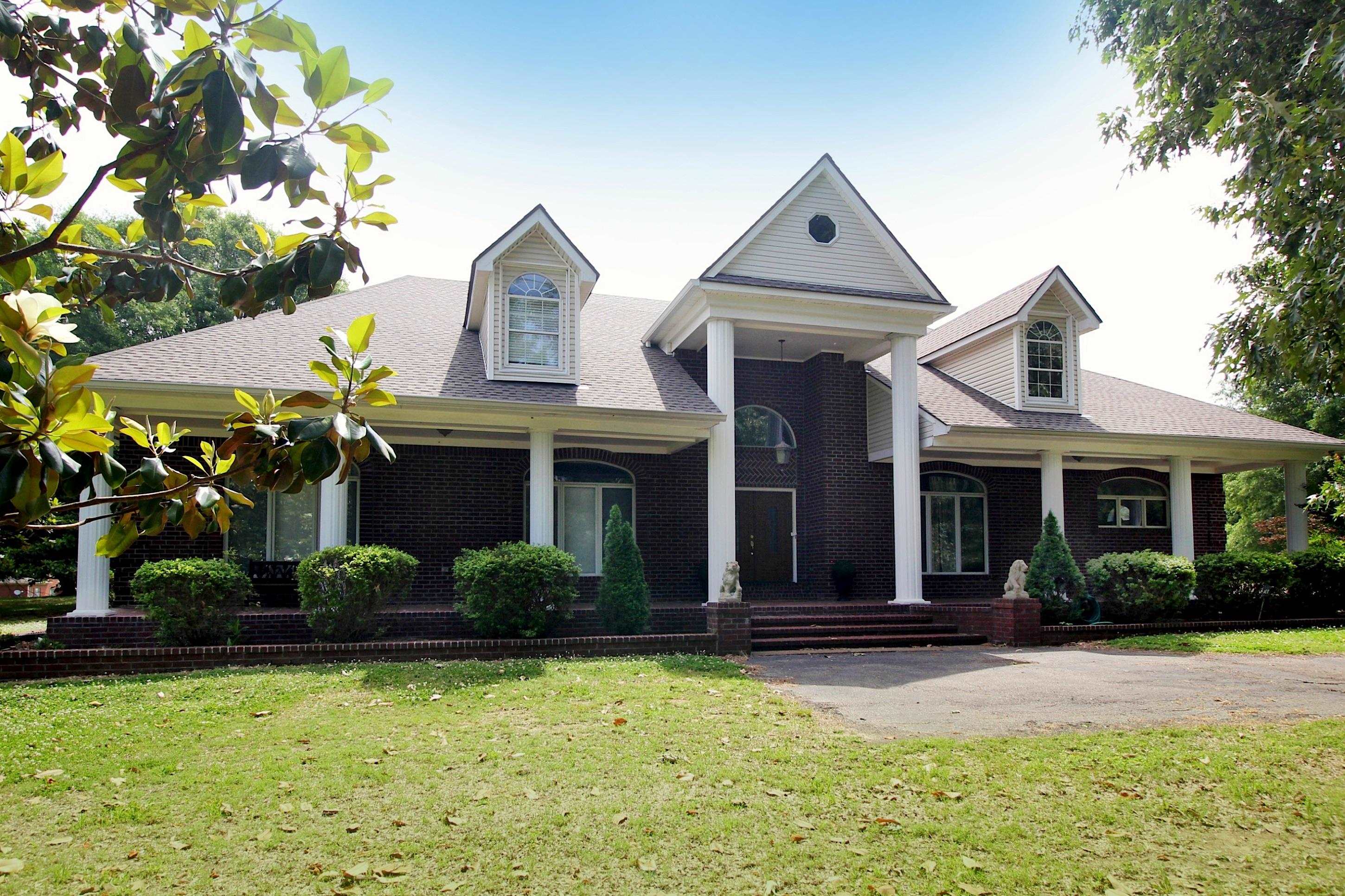 2550 North Reid Hooker Road Eads, TN 38028 - Photo 1 of 32 a front view of a house with garden