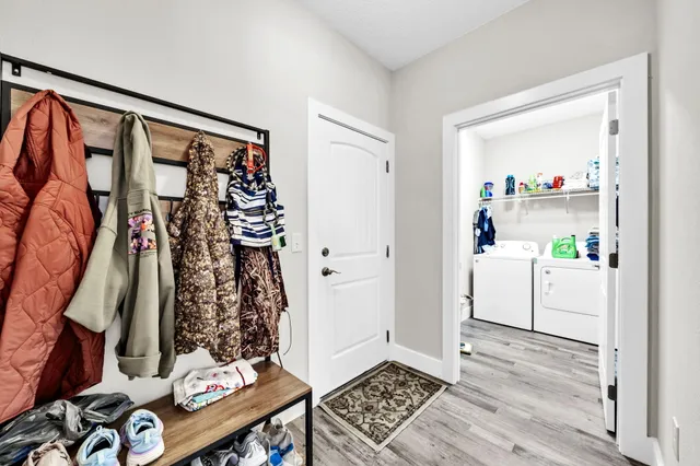 a view of storage and utility room with washer and dryer