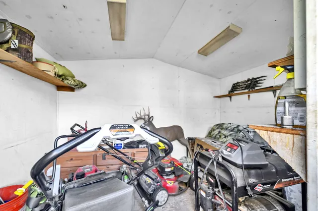 a utility room with dryer washer and other items