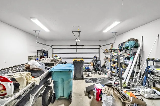 a utility room with dryer washer and other items