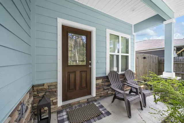a kitchen with counter top space and wooden floor