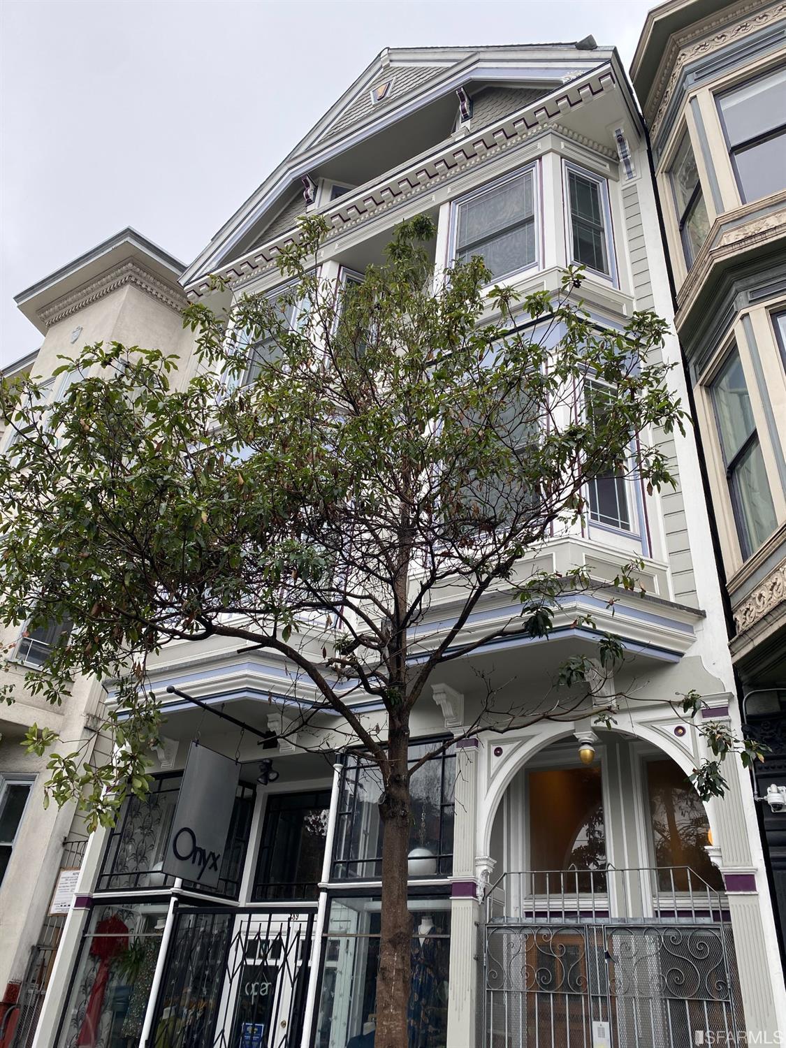 a view of a building with a tree