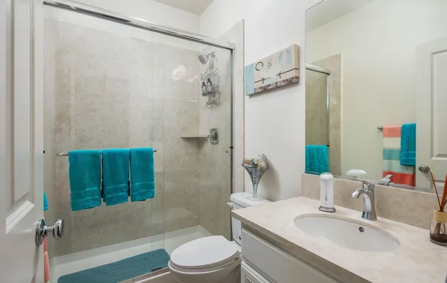 a kitchen with stainless steel appliances granite countertop a table chairs stove and kitchen island
