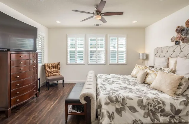 a bedroom with a bed and a couch