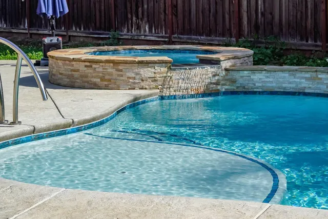 a view of swimming pool with a patio