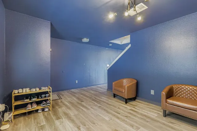 a room with furniture and wooden floor