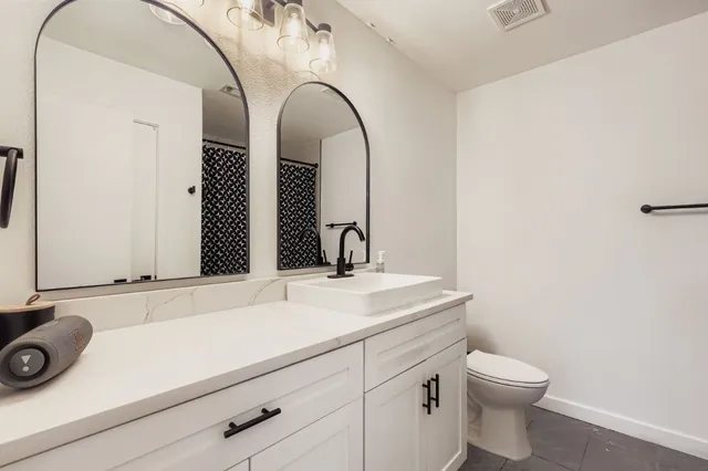 a bathroom with a sink and a toilet