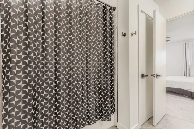 a bathroom with a shower curtain
