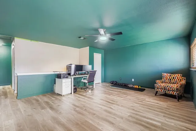 a workspace with furniture and window