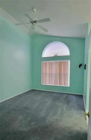 a view of a house with swimming pool and sitting area