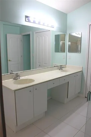 an aerial view of a house with a swimming pool