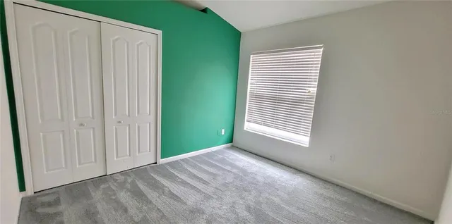 a park view with a bench and trees