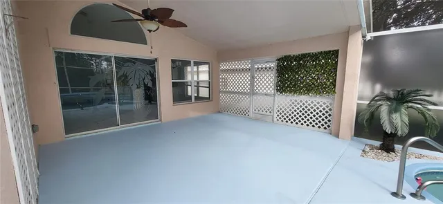 a kitchen with granite countertop a sink stove and refrigerator