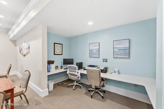 a view of a workspace with furniture