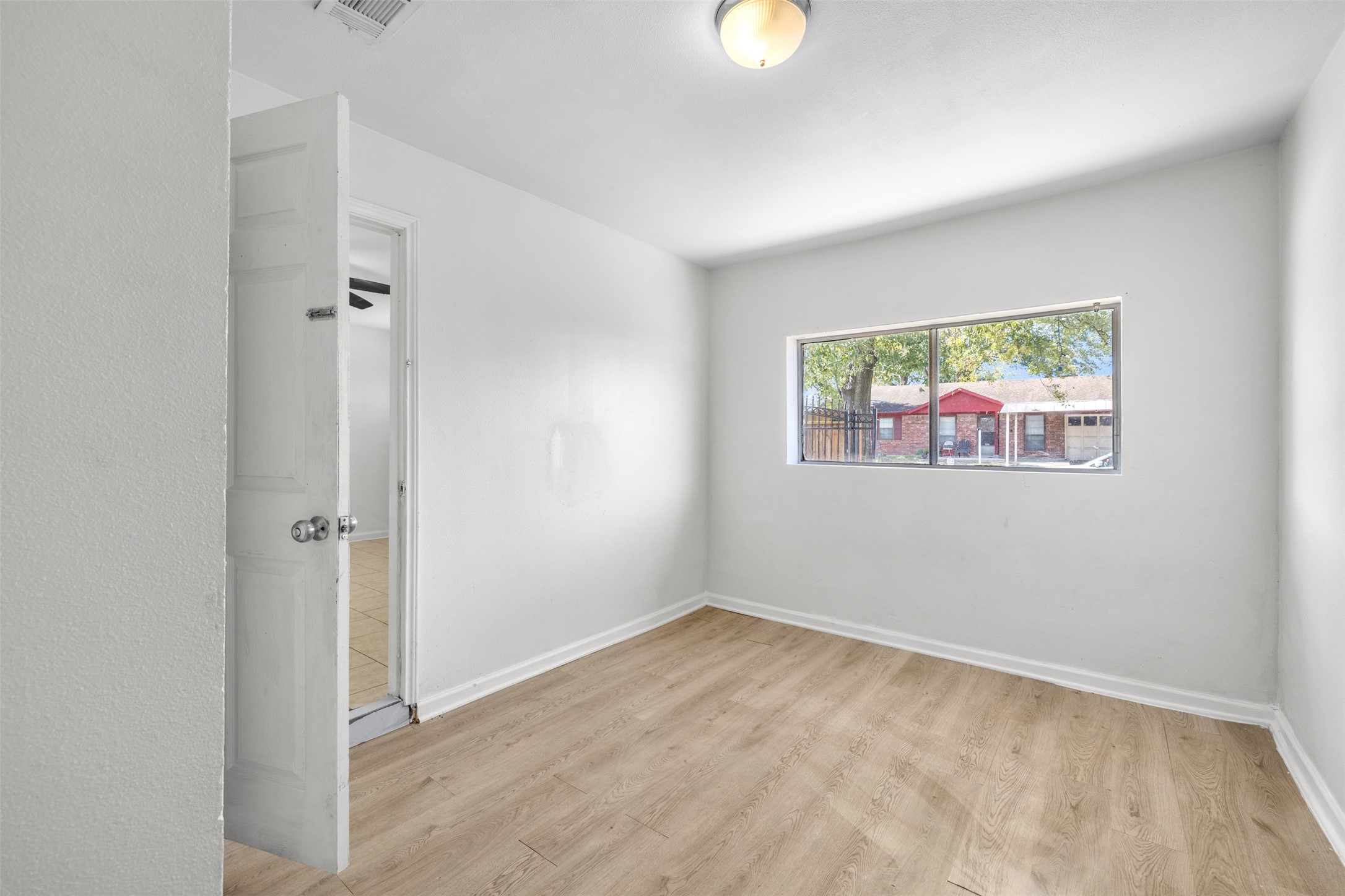 9802 Lum Lane Houston, TX 77078 - Photo 14 of 45 Another view of the 4th bedroom with a window looking out onto driveway