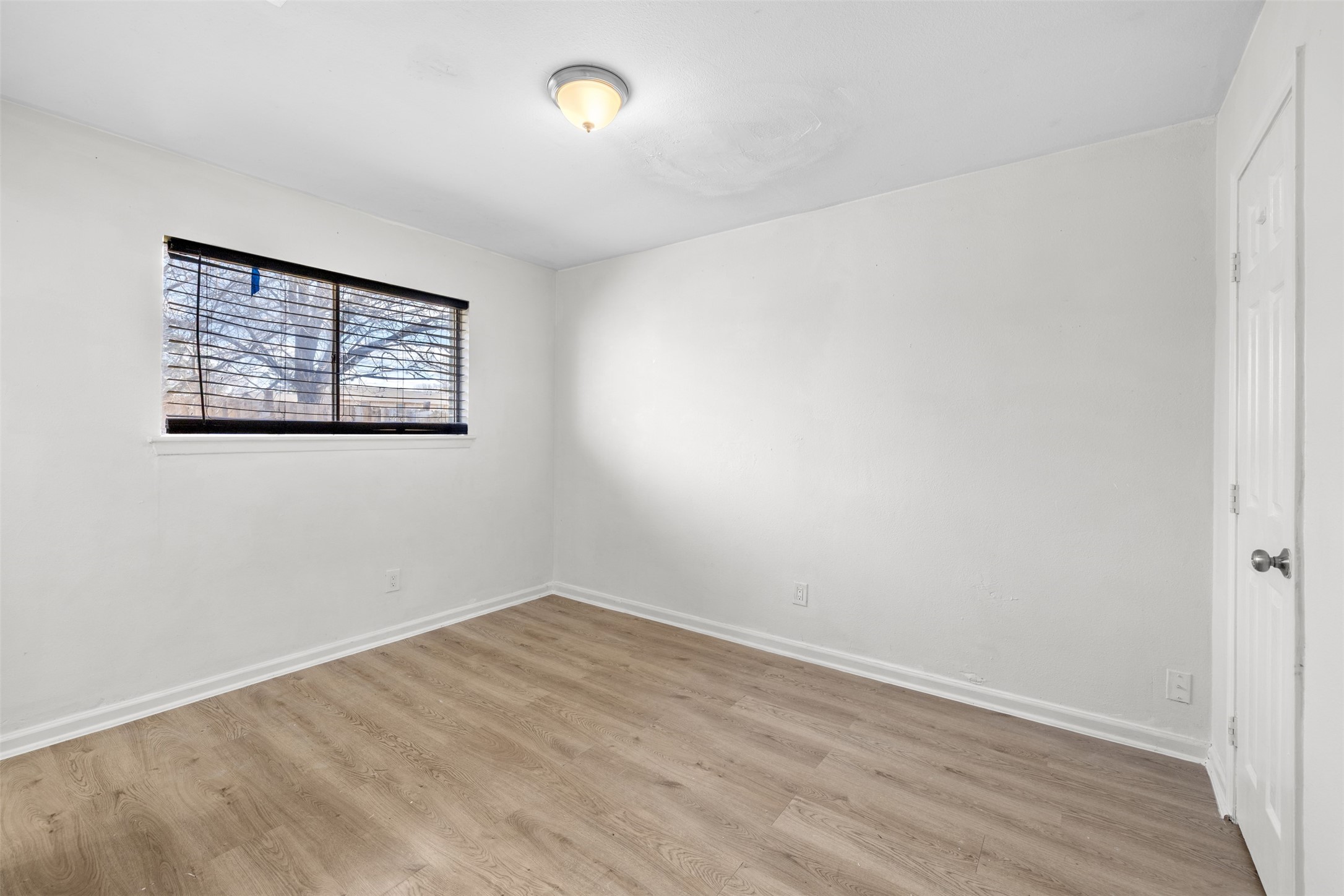 9802 Lum Lane Houston, TX 77078 - Photo 19 of 45 Primary bedroom in main home with a window facing right side of the home