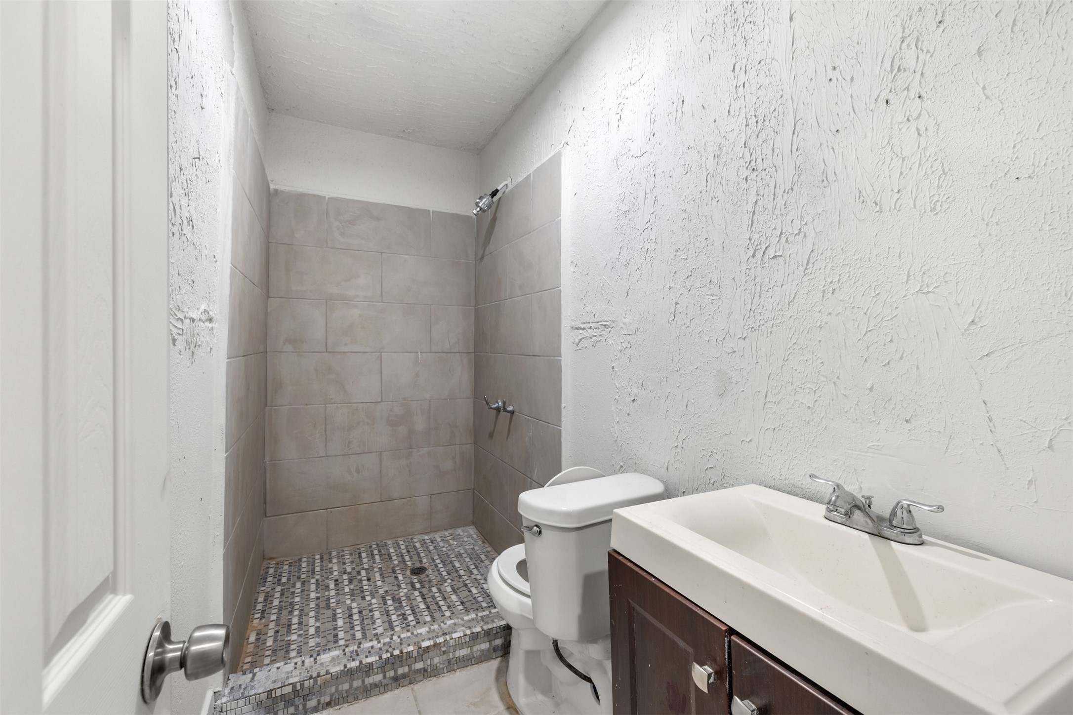 9802 Lum Lane Houston, TX 77078 - Photo 30 of 45 A full bathroom in the guest house with stand in shower