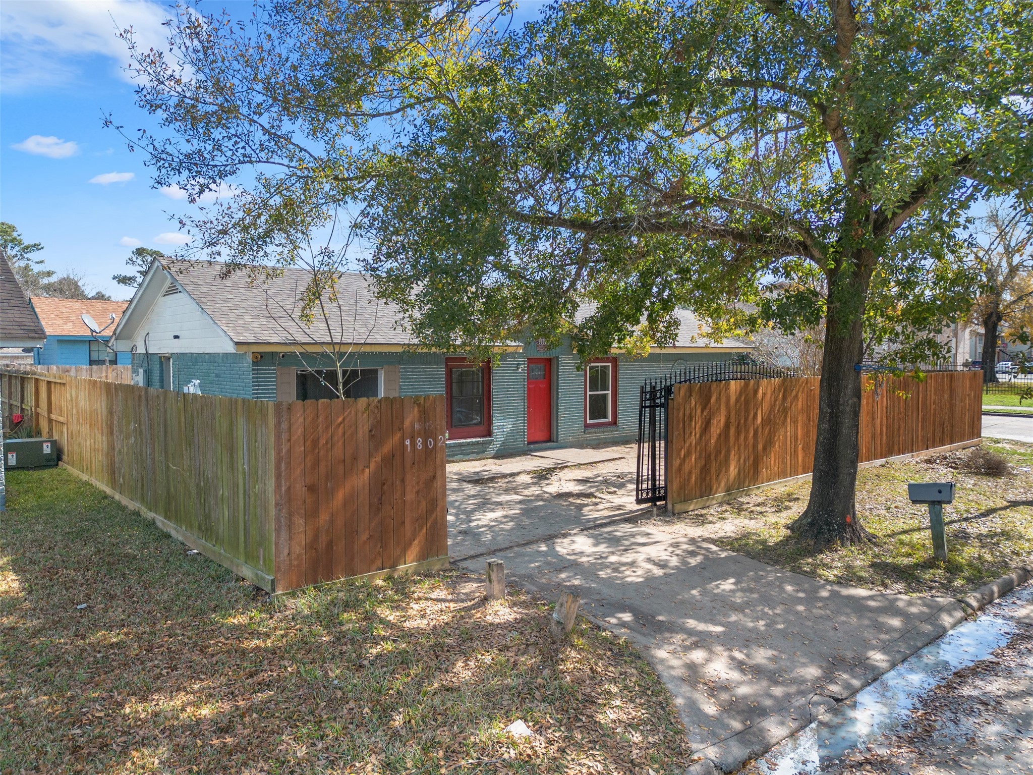 9802 Lum Lane Houston, TX 77078 - Photo 3 of 45 Drone street view showcasing the privacy gate and manned steel gate!