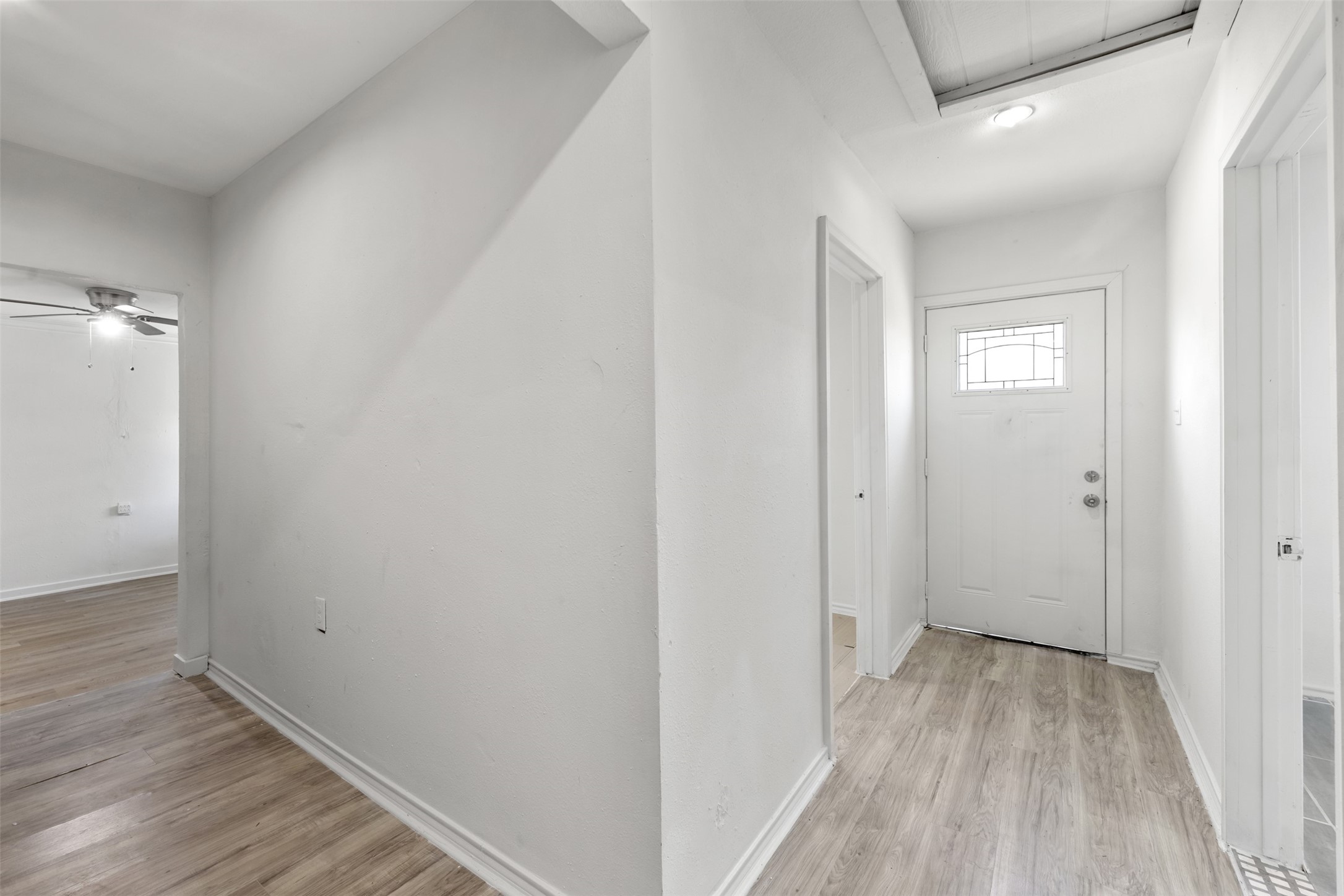 9802 Lum Lane Houston, TX 77078 - Photo 31 of 45 Guest House hallway in the facing the bedrooms on the right, and kitchen on left