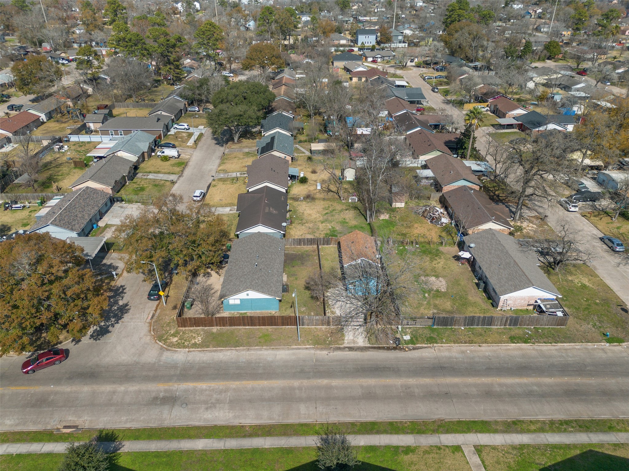 9802 Lum Lane Houston, TX 77078 - Photo 37 of 45 Drone overview of neighborhood! This home sits on a corner, Here you can see both the primary and secondary home with its unique blue paint!